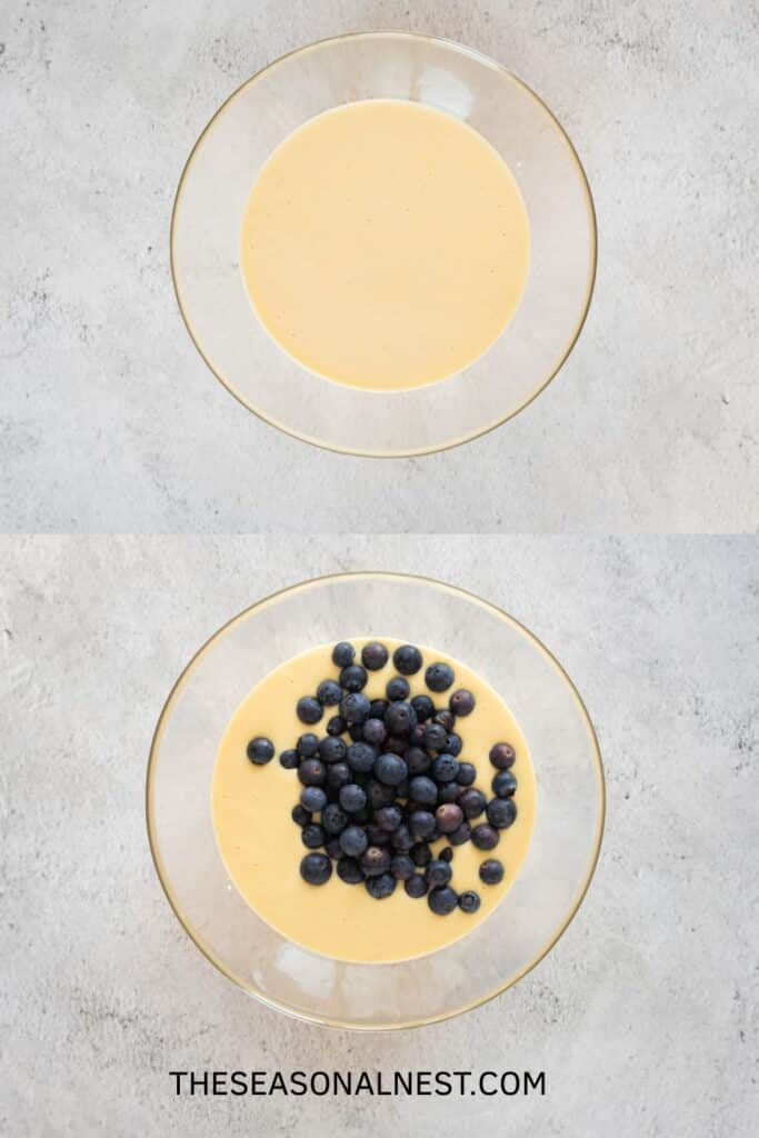 Pancake batter in a bowl with fresh blueberries added before mixing.