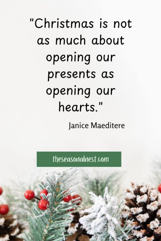 Inspirational words about the joy of opening hearts at Christmas, displayed with frosted greenery and red berries for a holiday quote.