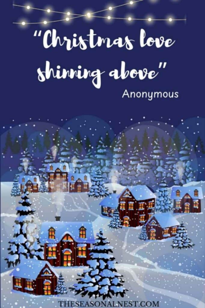 A cute Christmas quote written on a blue card with a picture perfect snowy village.