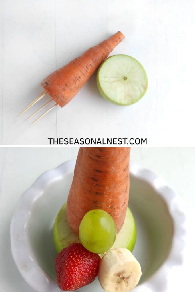 Base of a Christmas fruit tree made with a carrot and half an apple secured with toothpicks, forming a sturdy stand for stacking fruit.