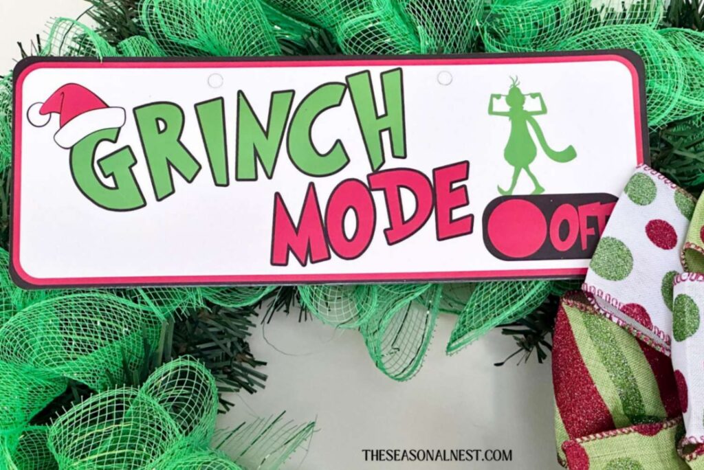 Adding a Grinch sign to the front of the wreath