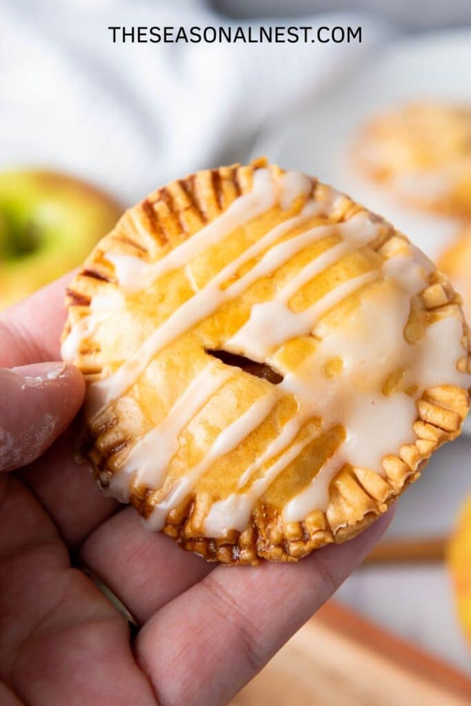 Homemade mini apple pie bite with glaze – handheld apple tart for fall treats.