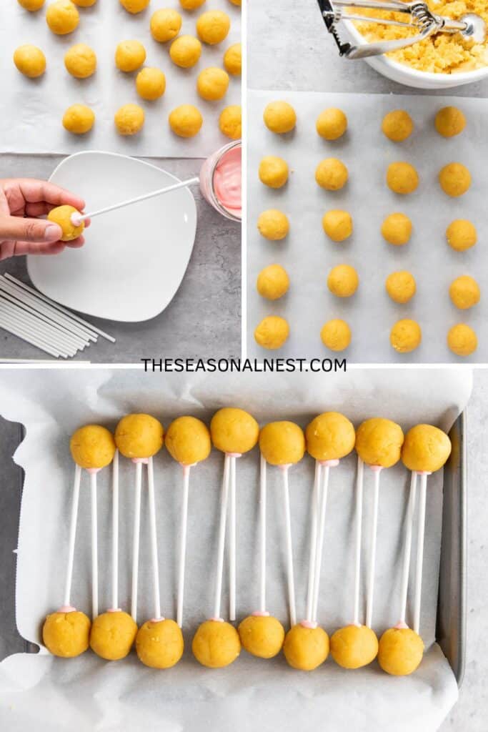 Rolled cake pop balls on parchment paper, with a hand dipping a stick in melted pink coating and inserting it into each ball.