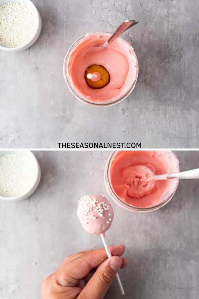 Cake pop being dipped into melted pink candy coating, then lifted and decorated with white sprinkles.