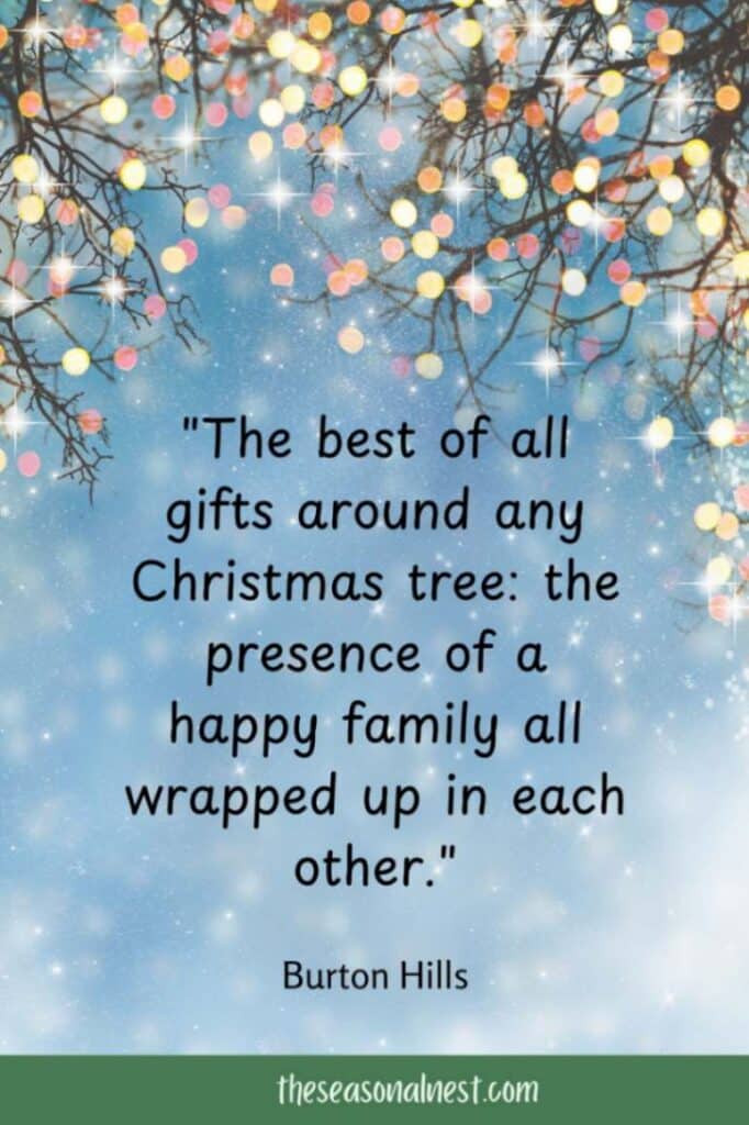 A beautiful Christmas quote about family wrapped in love, surrounded by sparkling lights and a snowy magical background.