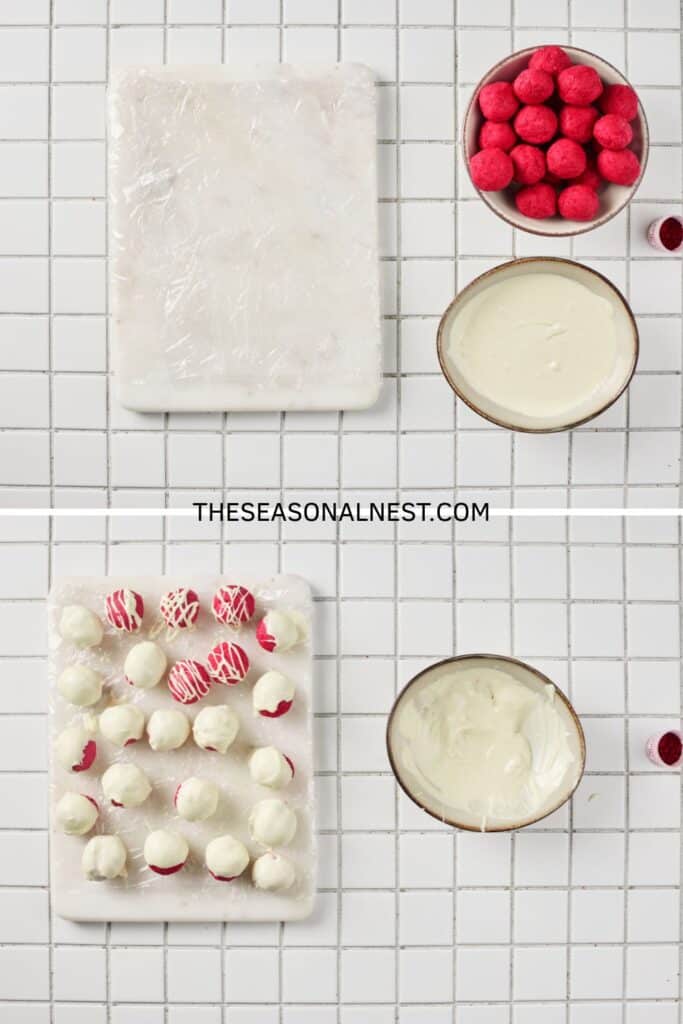 Red velvet truffle balls being dipped in melted white chocolate and set on a tray to dry.