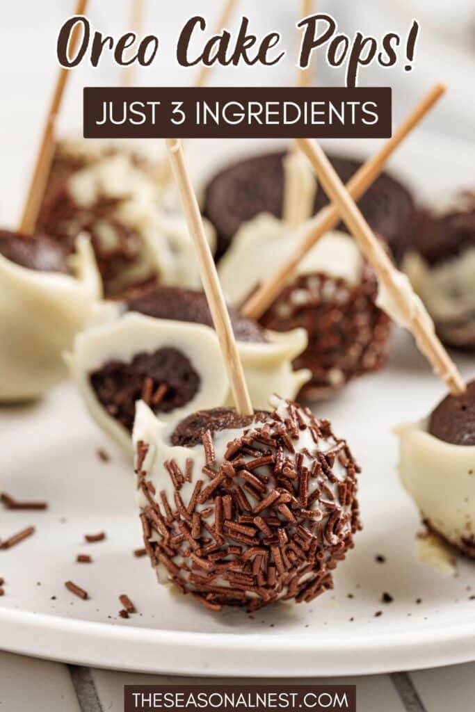 Oreo cake pops coated in white chocolate and sprinkles, arranged on a plate with whole Oreo cookies and a banner.
