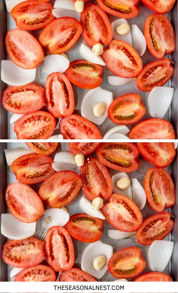 A handful of half fresh tomatoes, onions and garlic on a baking tray.