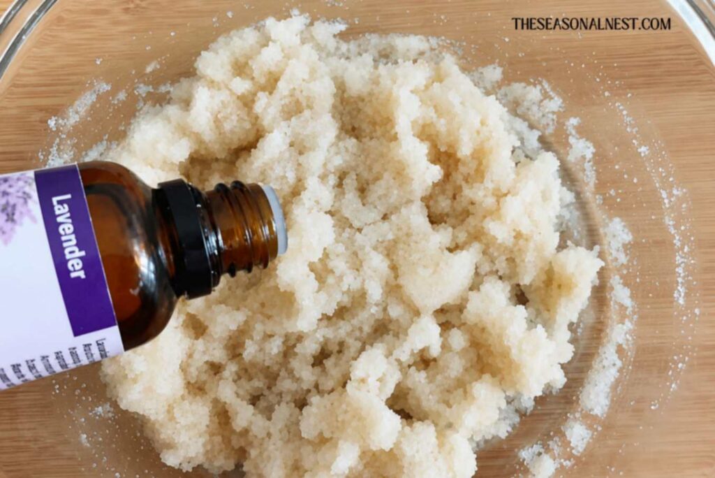 Adding essential oil to oatmeal scrub.