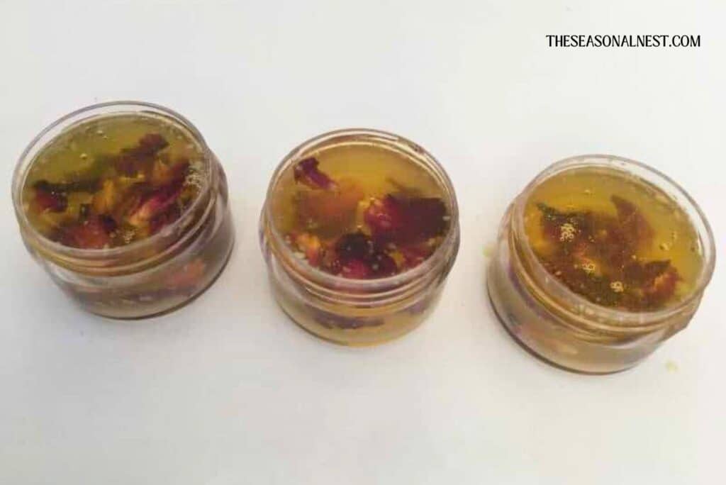 Lip containers with melted beeswax and rose petals