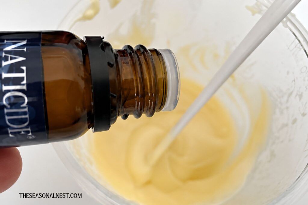 Adding a preservative to the emulsified face cream.