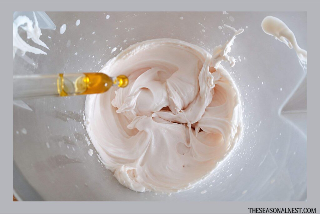 Adding rosehip oil to the maple cream mixture.