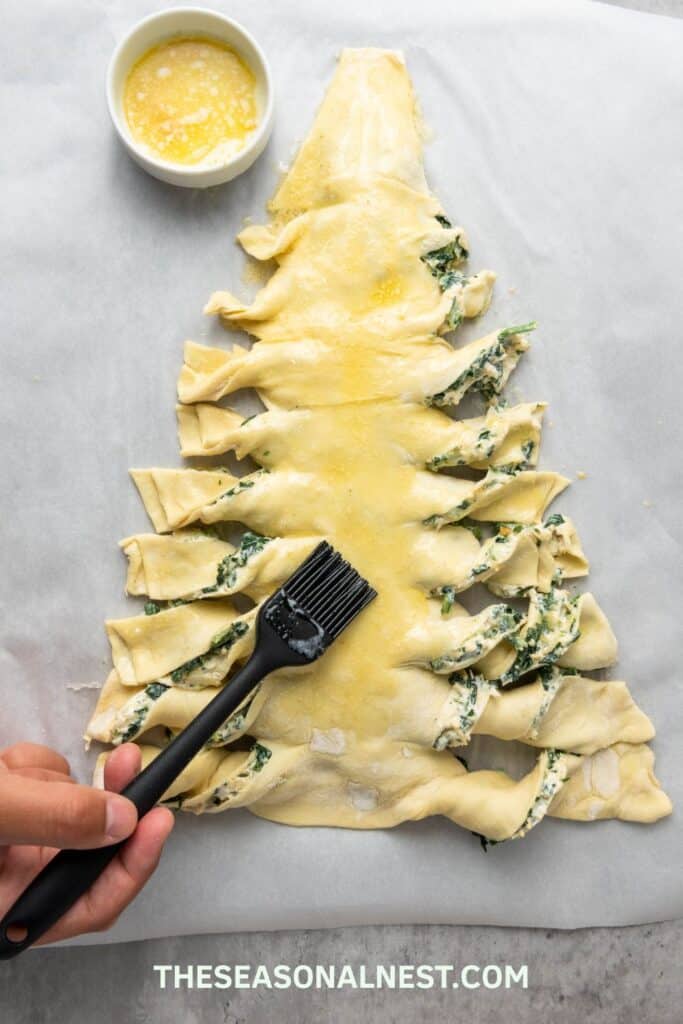 Brushing butter over a Christmas Tree Appetizer