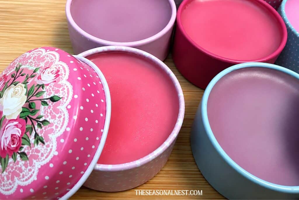 Clese up of assorted tinted homemade lip balms in containers