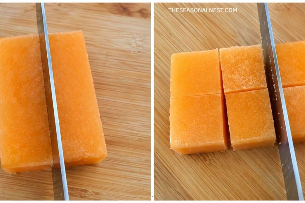 Cutting orange scrub block into cubes with a knife.