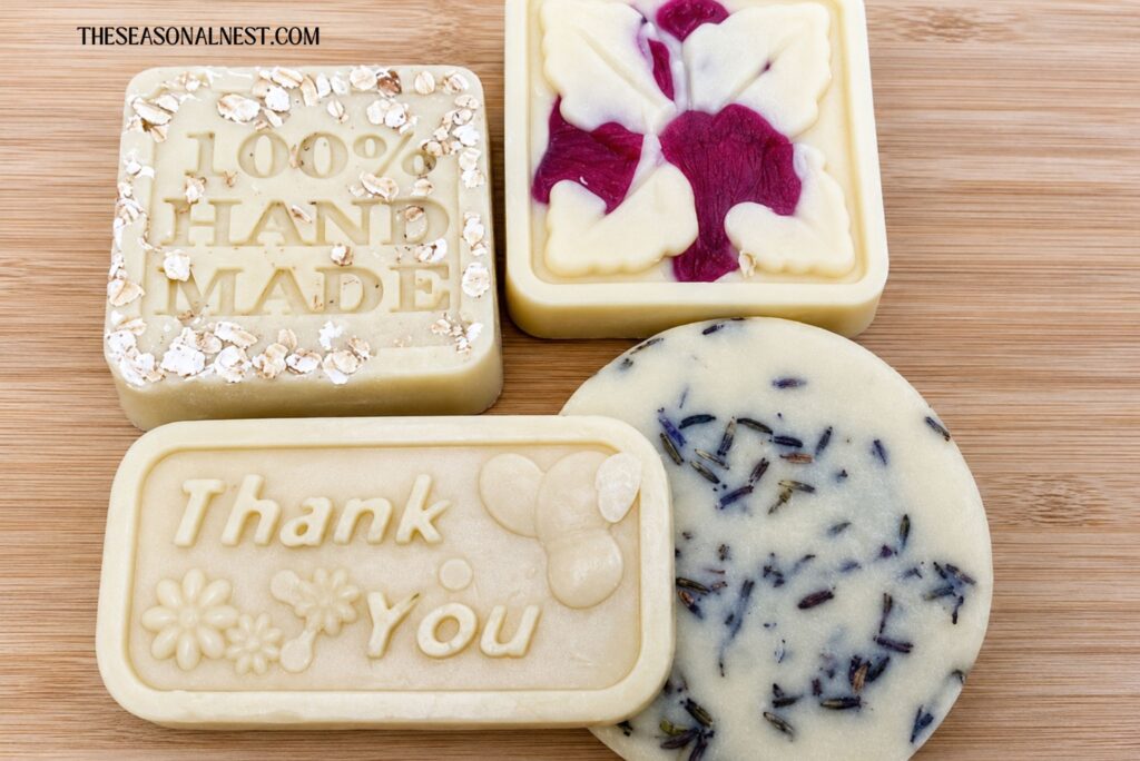DIY lotion bars with beeswax on a wooden background.