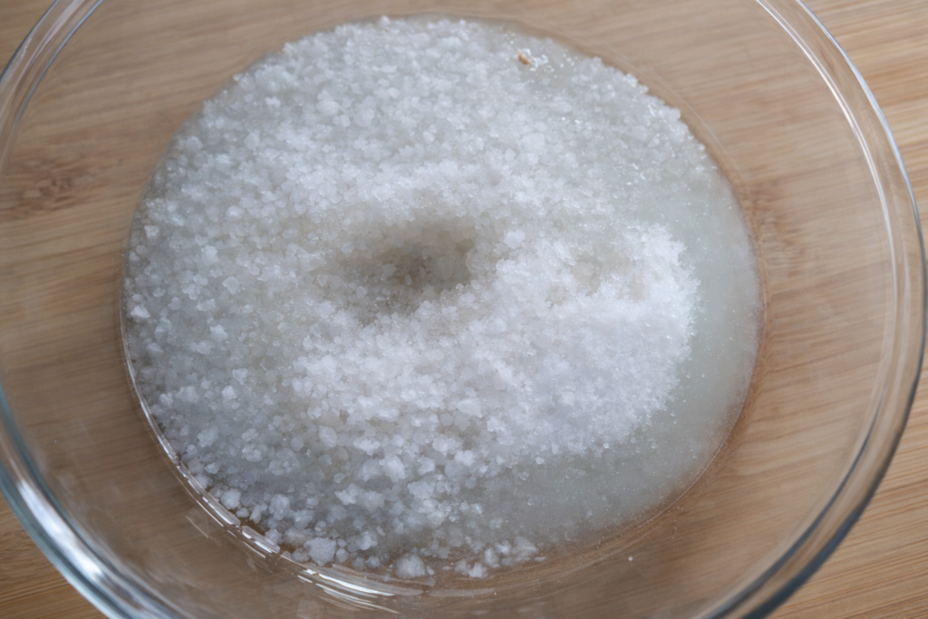 Sugar, salt, and carrier oil in a bowl