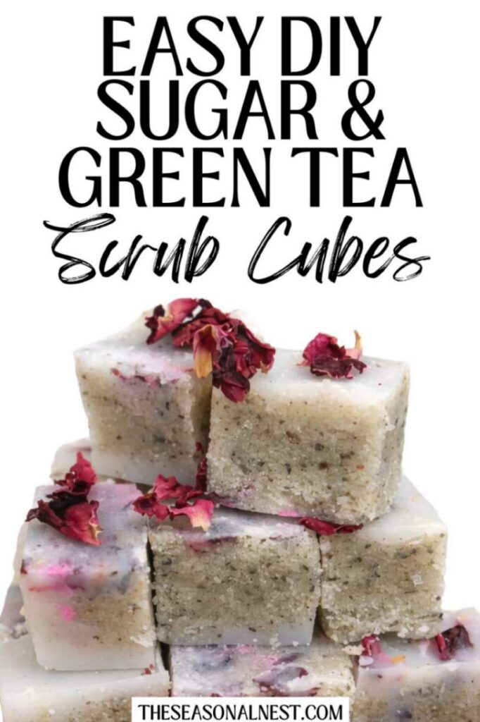 Close up stacked sugar and green tea scrub cubes with scattered dry petals