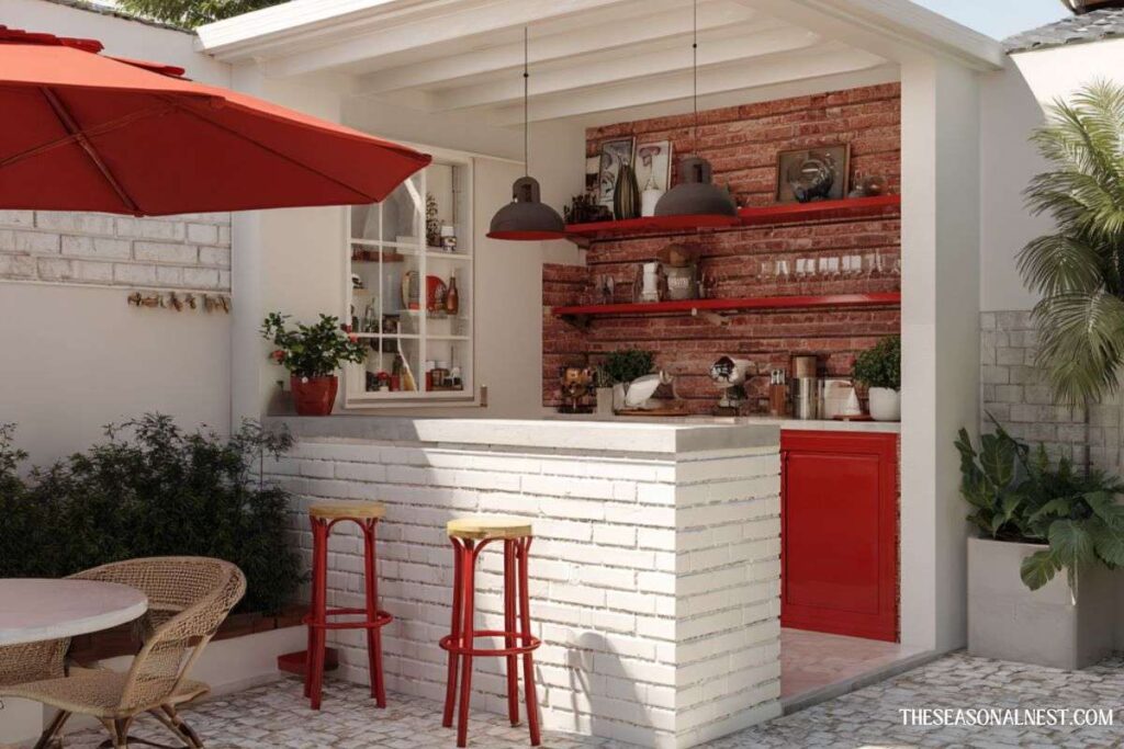 Outdoor bar with white brick counter, red shelves and stools, exposed brick wall, and patio seating area.