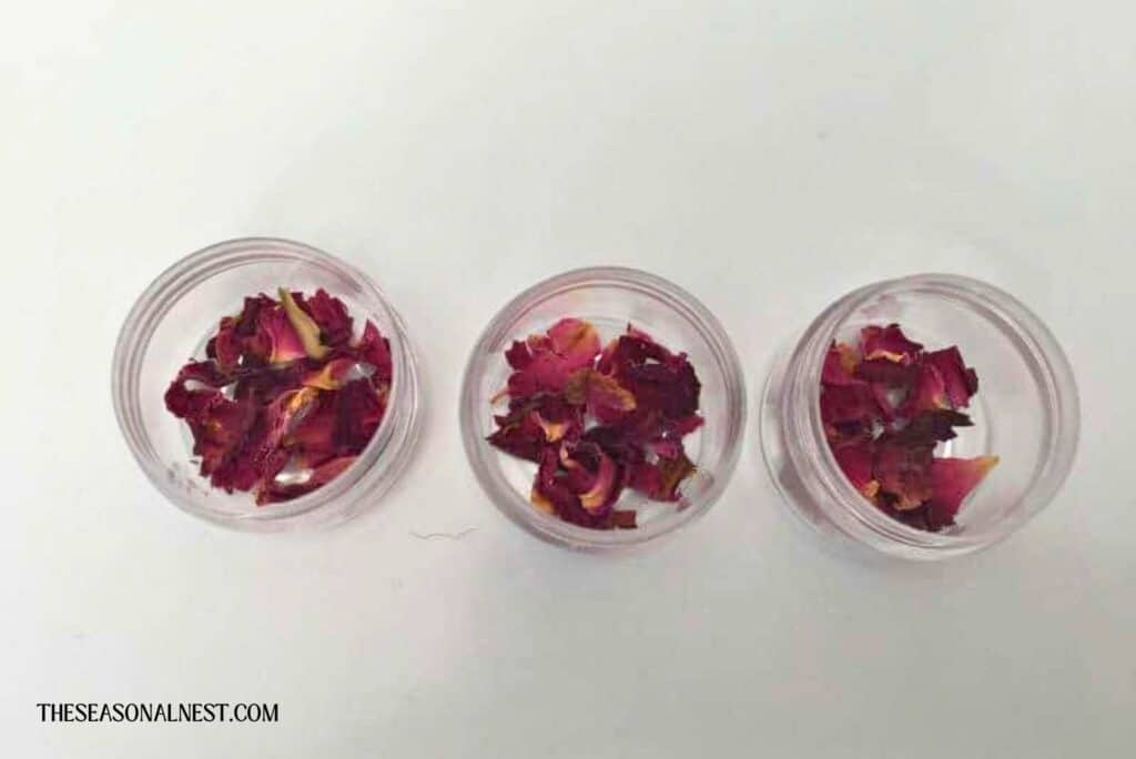 Dry rose petals on lip balm container