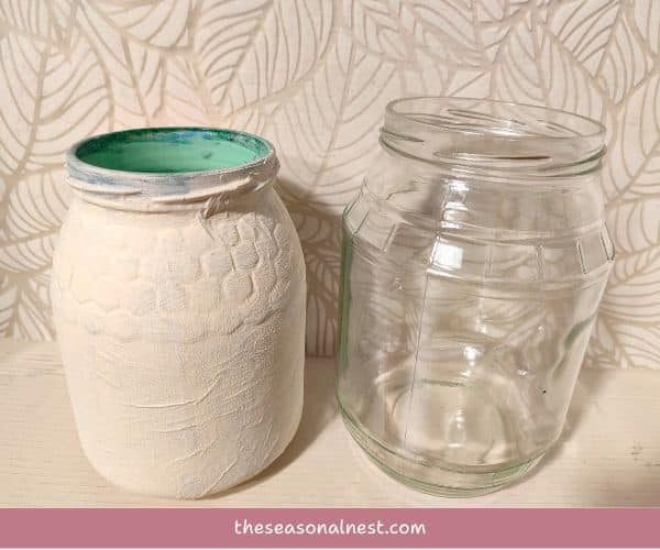 One clear glass jar and one white textured jar.