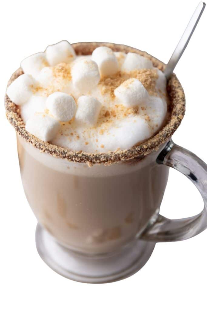 Homemade s’mores latte coffee drink topped with marshmallows and graham cracker crumbs