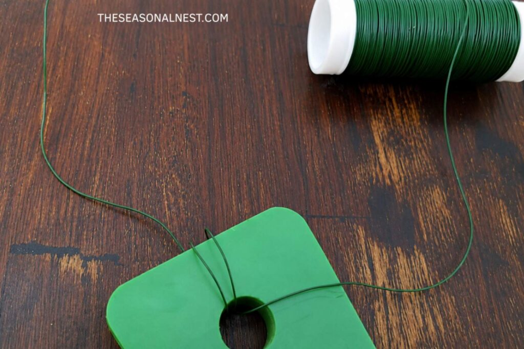 Wire to attach wooden board to the wreath